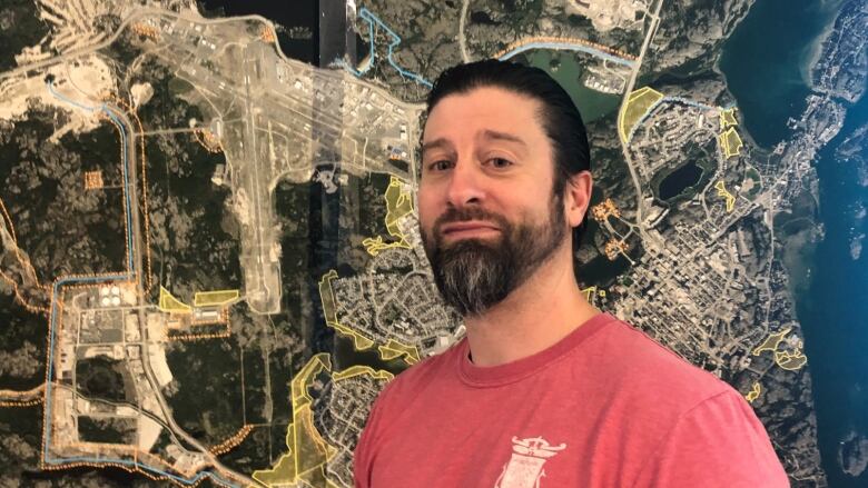 Man stands in front of a map showing fire protections