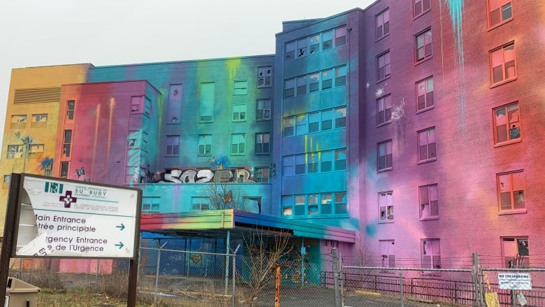 A building with faded colours on it.