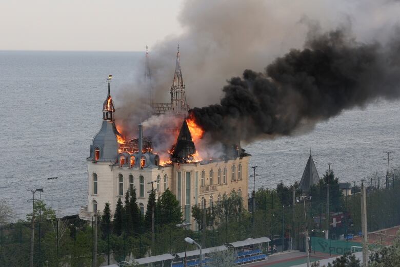 A building of the Odesa Law Academy is seen on fire in Odesa, Ukraine, following a Russian missile attack.