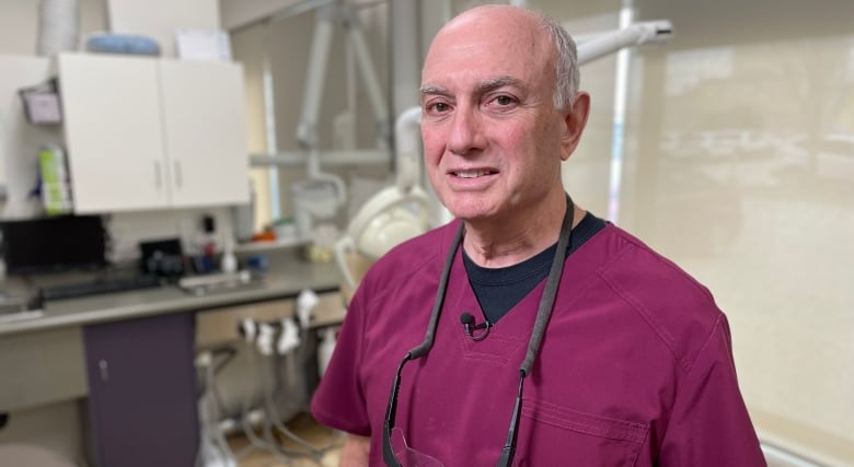 Dr. Joel Antel stands in his Winnipeg dental office.