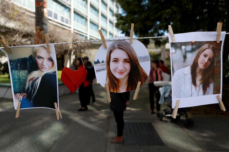 Moms Stop the Harm advocates and supporters march from Centennial Square to the Ministry of Health building where pictures of loved ones hang on display during the sixth anniversary to mark the public health emergency of the declaration due to the significant increase in opioid-related overdose across the province during the Cut The Red Tape theme in Victoria, Thursday, April 14, 2022.