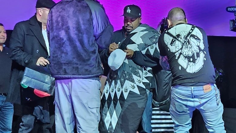 Rapper, Ice cube, on stage receiving custom made star blanket