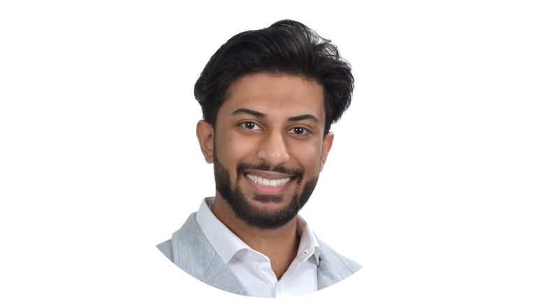 A young Pakistani-Canadian man in a suit.