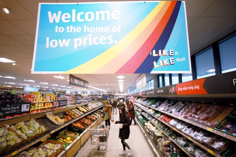 A sign hanging in a grocery store reads 