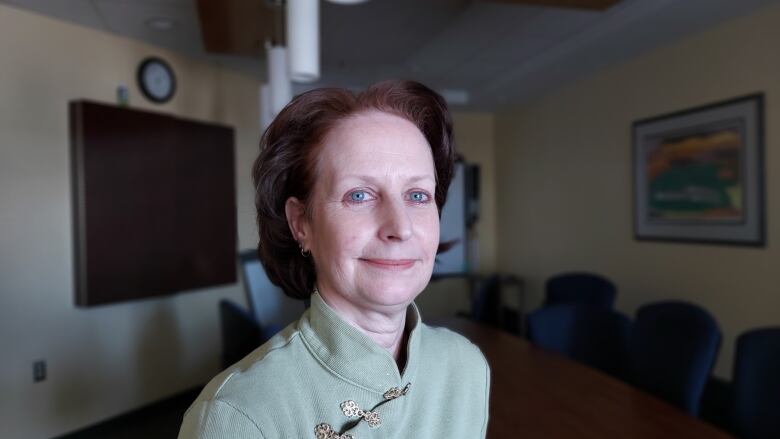 Jane Bates in her office's board room