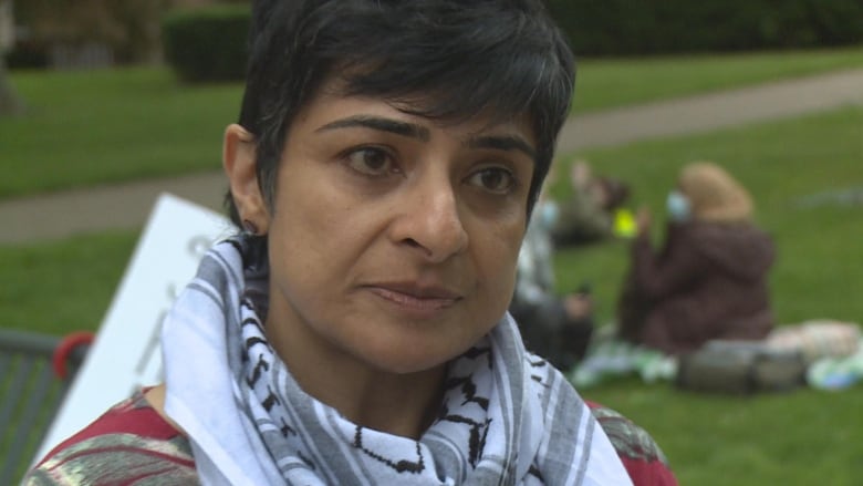 A close up of a woman near a camera