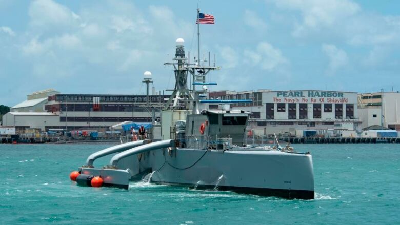 In this image provided by the U.S. Navy, a Sea Hunter, a crewless vessel, arrives at Pearl Harbor, Hawaii, to participate in the Rim of Pacific (RIMPAC) 2022 on June 29, 2022.