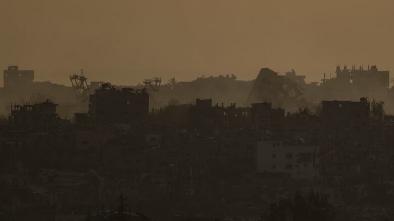 Destroyed buildings are seen in the Gaza Strip, in an image captured from southern Israel at sunset on May 9, 2024.