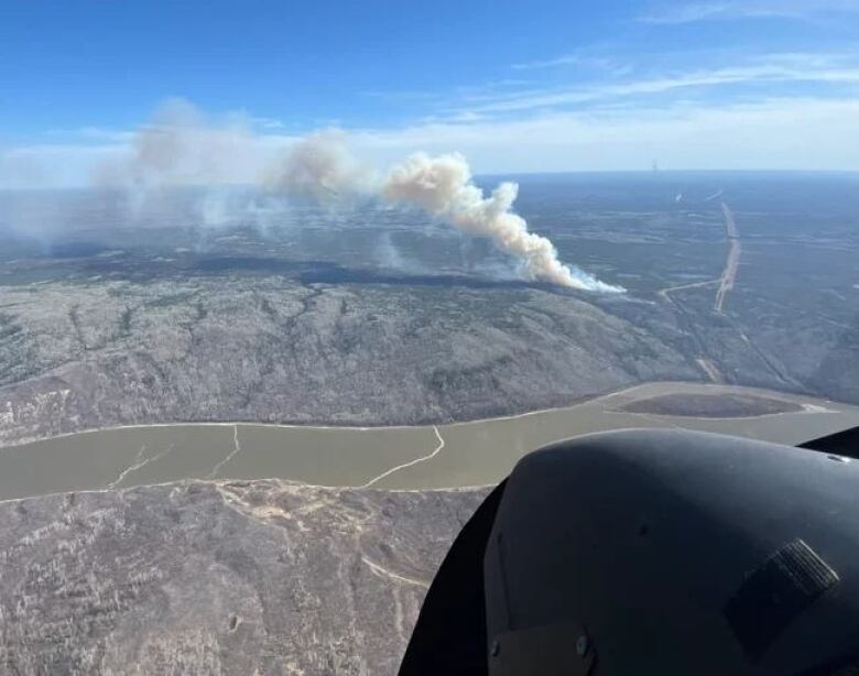 A plume of smoke is seen from an aerial view. 