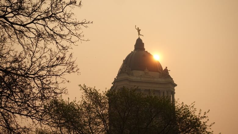 A smoky sky over the Manitoba Legislative Building.