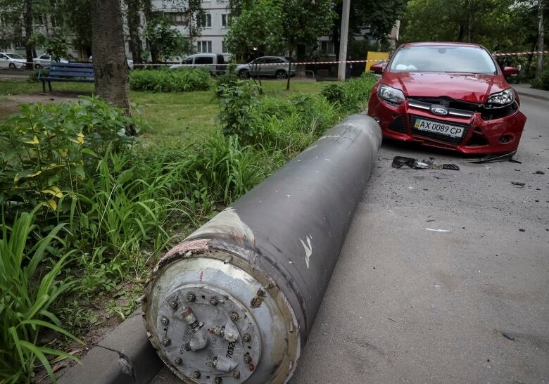 A missile fragment is seen on the ground in Kharkiv, Ukraine, following a Russian missile attack.