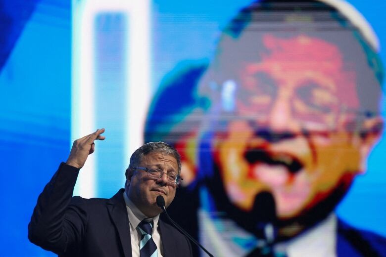 Israel's National Security Minister Itamar Ben-Gvir speaks at a convention calling for Israel to rebuild settlements in the Gaza Strip and the northern part of the Israeli-occupied West Bank, in Jerusalem, January 28, 2024. 