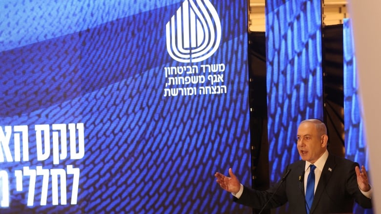 Israeli Prime Minister Benjamin Netanyahu speaks during a ceremony marking Memorial Day for fallen soldiers of Israel's wars and victims of attacks, at Jerusalem's Mount Herzl military cemetery, May 13, 2024. 