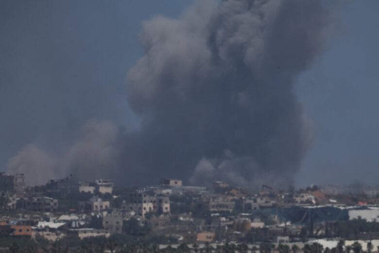 Smoke rises from an explosion following an Israeli airstrike in northern Gaza, near the Israel-Gaza border, amid the ongoing conflict between Israel and the Palestinian Islamist group Hamas, as seen from Israel, May 16, 2024. 