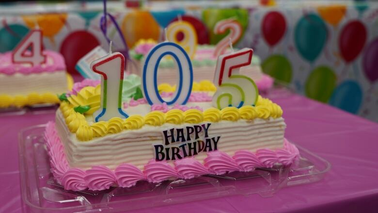 A colourful birthday cake, with 105 on it