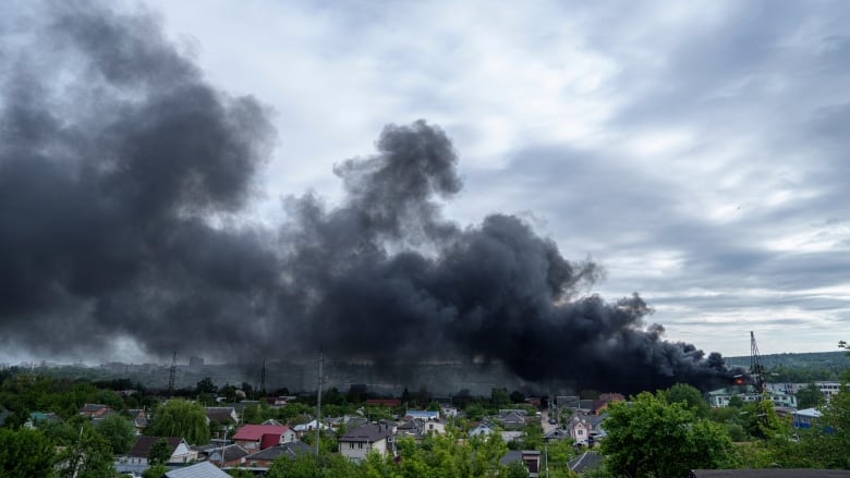 Smoke is seen rising in Kharkiv, Ukraine, in the aftermath of a Russian attack.