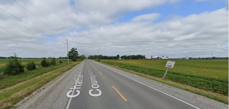 A straight two-lane rural road.