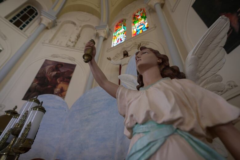 Religious carvings in church and stained glass