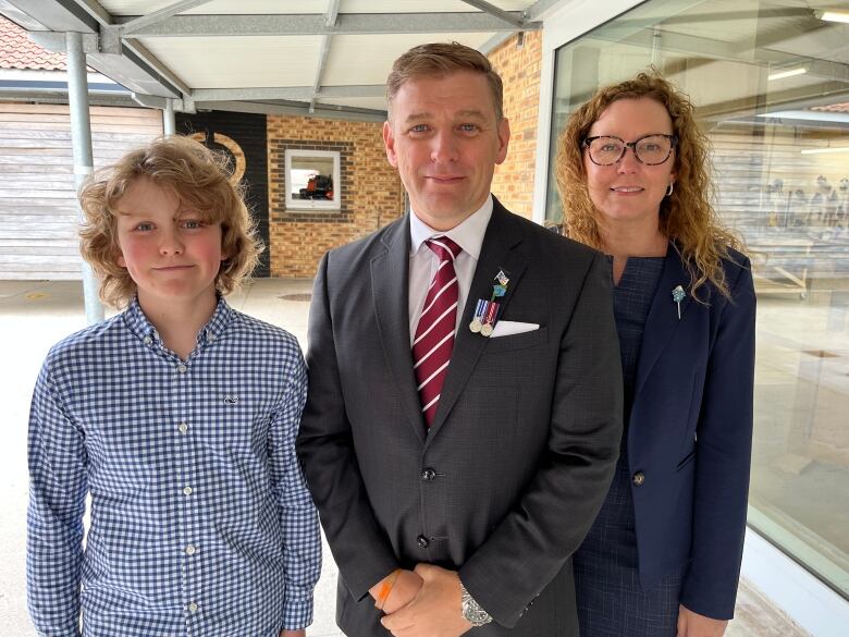 premier andrew furey and his wife and son.