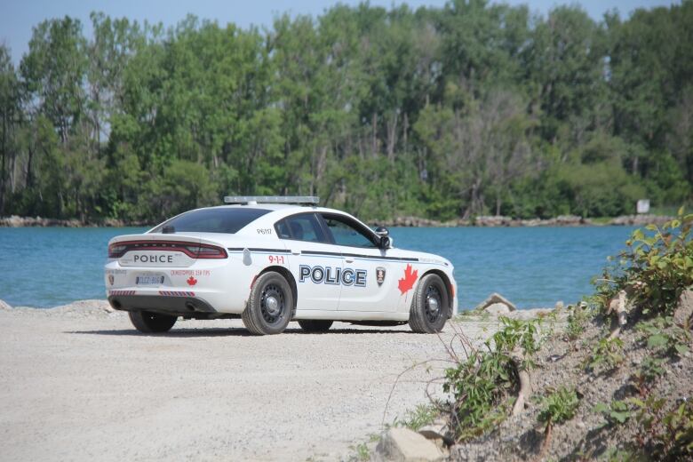 Windsor police cruiser is parked in the area where two students went missing at Sandpoint Beach.