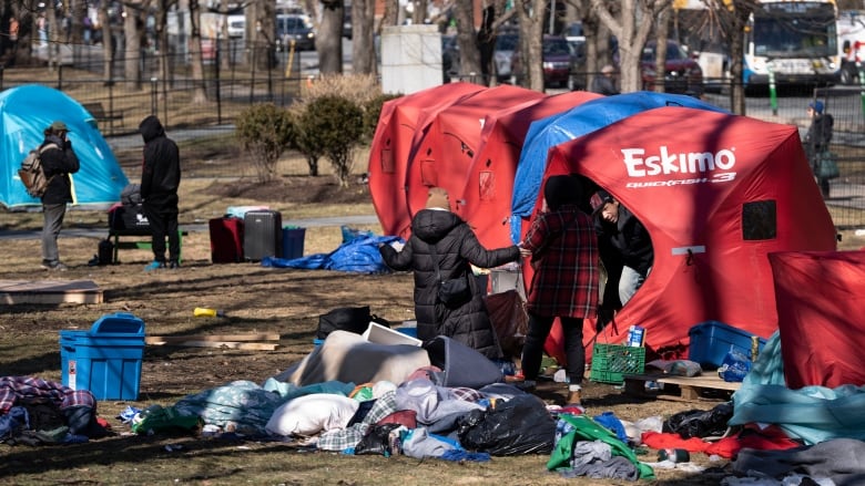 Street navigators help relocate residents from the homeless encampment in Victoria Park in Halifax's downtown on Monday, March 4, 2024. 