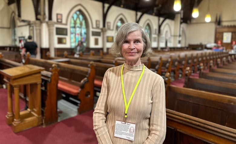 A woman standing inside a church