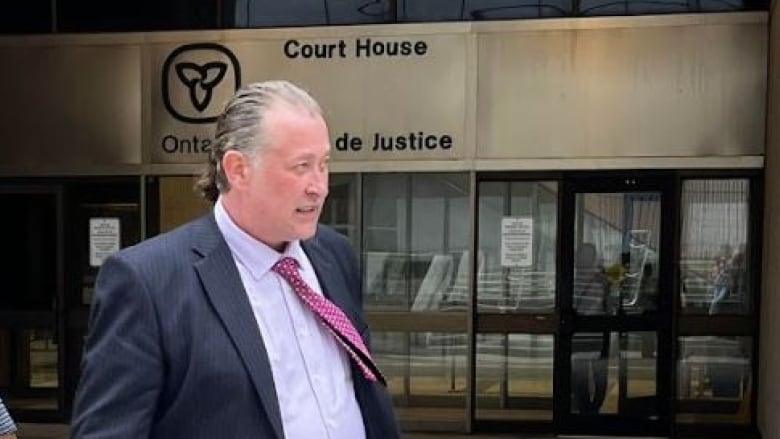 Former Woodstock mayor Trevor Birtch leaving court in downtown London, Ont., on Monday. 