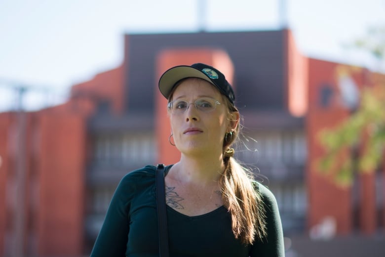 A person standing in front of a jail.