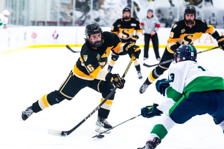 An on ice action shot of minor hockey