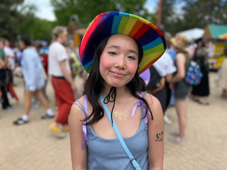 A person with a rainbow hat. 