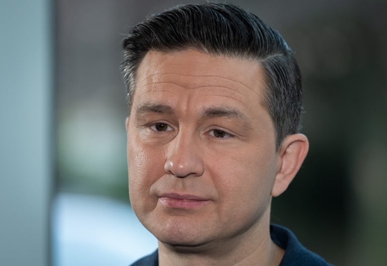 Conservative Leader Pierre Poilievre listens to media questions during a news conference on safety in hospitals in Vancouver