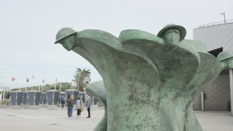 A statue on a beach.