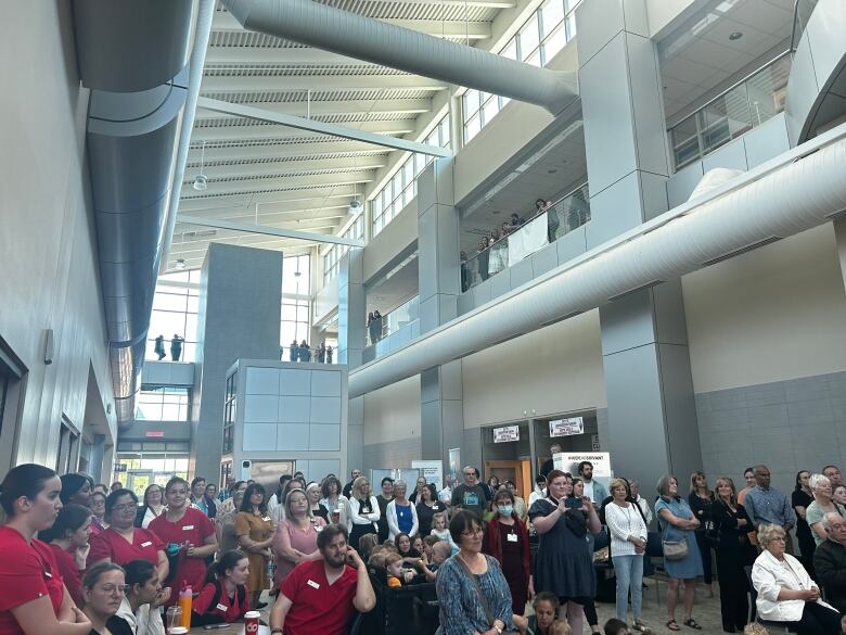 An atrium is filled with people.