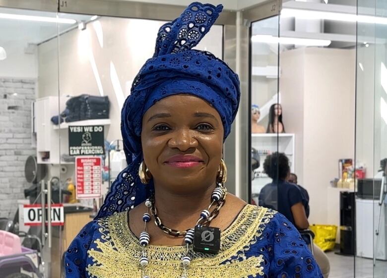 Bukola Ojemakinde is pictured outside Kariata Beauty in New Horizon Mall.