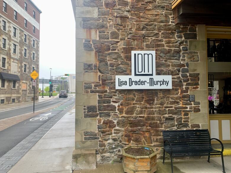 A sign is shown at a business in Historic Properties.