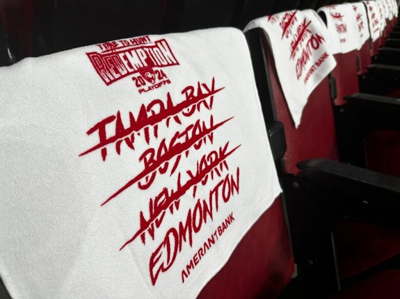 A white towel has the names of four cities written in red: Tampa Bay, Boston, New York and Edmonton. Only Edmonton is not crossed off.