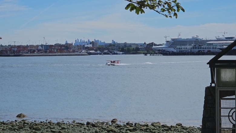 Photo captures a Harbour Air floatplane colliding with a boat in Vancouver's Coal Harbour near Stanley Park on Saturday. 