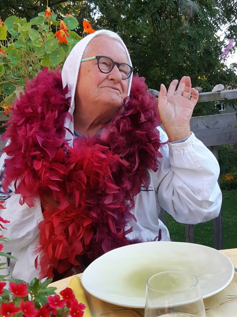 A man wearing a boa 