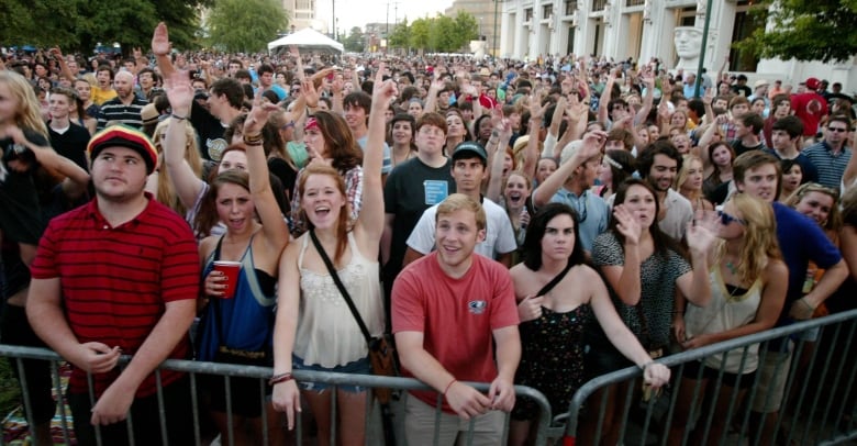 A large crowd in the thousands watches Radio Radio perform a show in downtown Lafayette, La., on April 27, 2012.