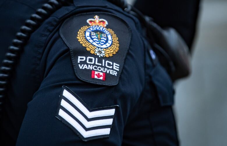 An up-close picture of a Vancouver Police Department shoulder badge.