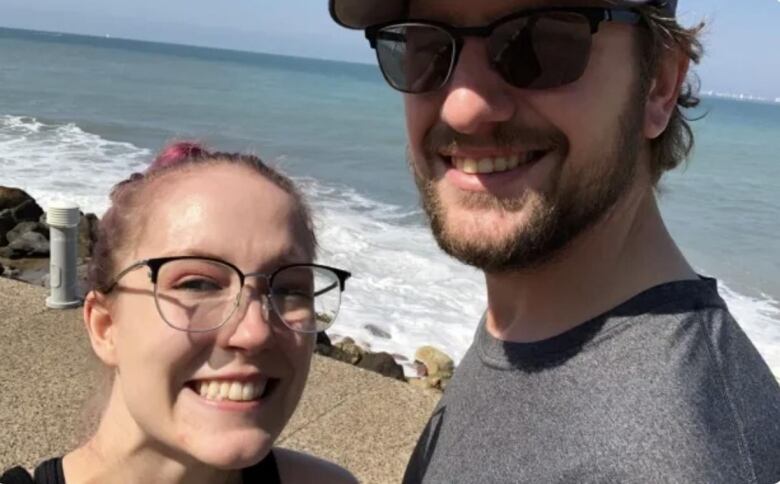 taryn on the beach with her husband