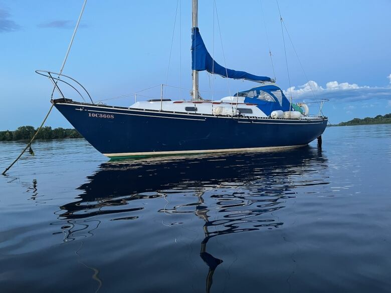 The Blue Lotus, which sports a deep blue and green two tone color scheme, is moored in the St John River. 