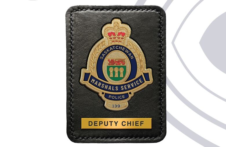 A police badge with the words 