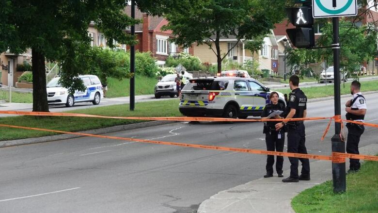 police officers talking at site of collision