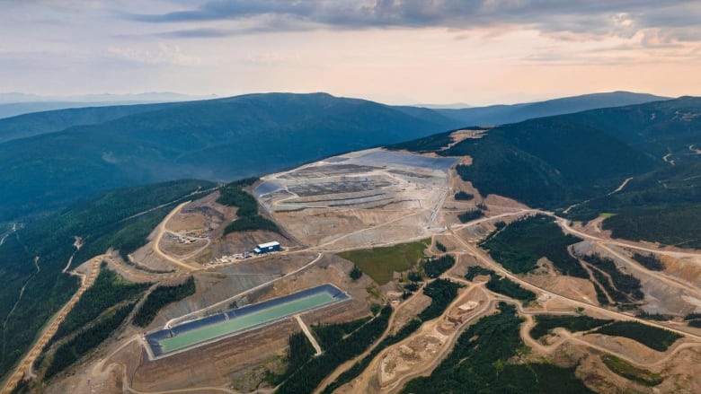 An aerial view of a mine site on a remote hilltop.