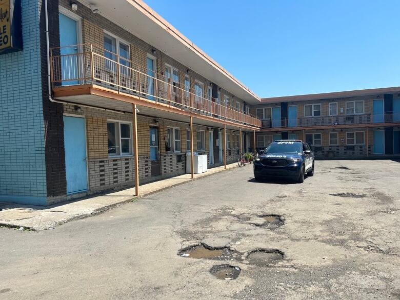 a police car outside a motel