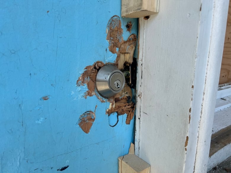 a blue damaged door