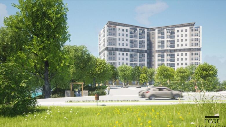 A boxy grey and white building rises above green leafy trees and a grey car driving by