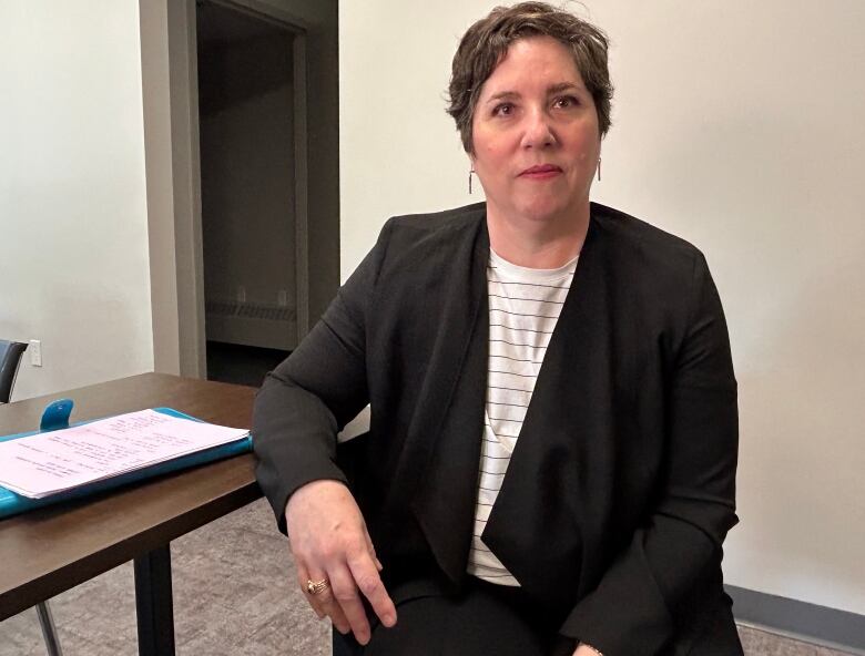 Bobbi Jo Flynn sits in one of the meeting rooms used by domestic violence court, She is the director of policy, planning and intergovernmental relations with Justice and Public Safety. 