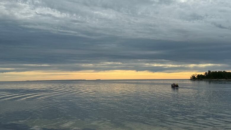 A boat moves on a body of water.